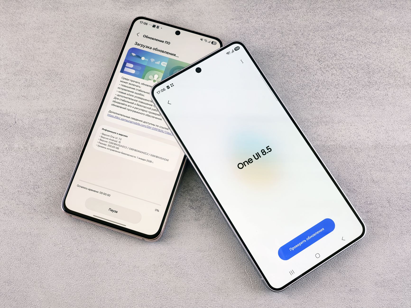 A person comparing Apple and Android software updates on their smartphones